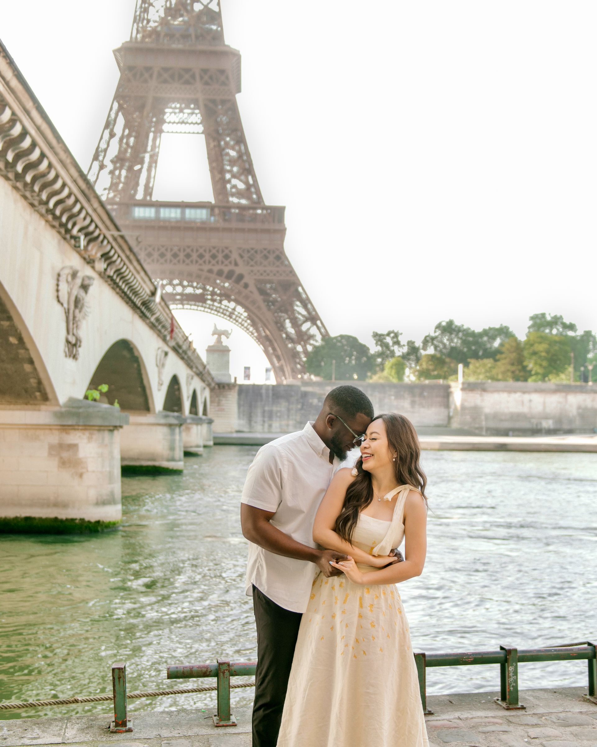 Couple beneath the Eiffel Tower in Paris, France
