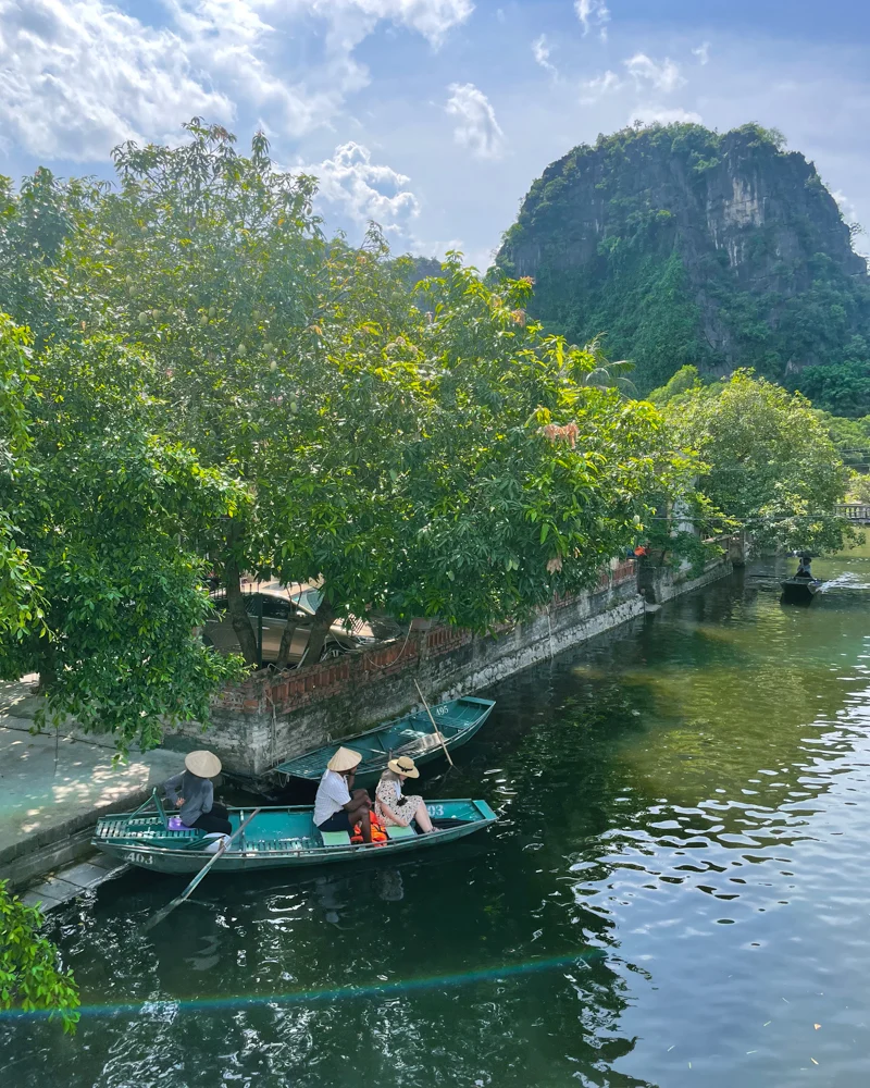 Couple on boat ride in Tam Coc in Ninh Binh, Vietnam.