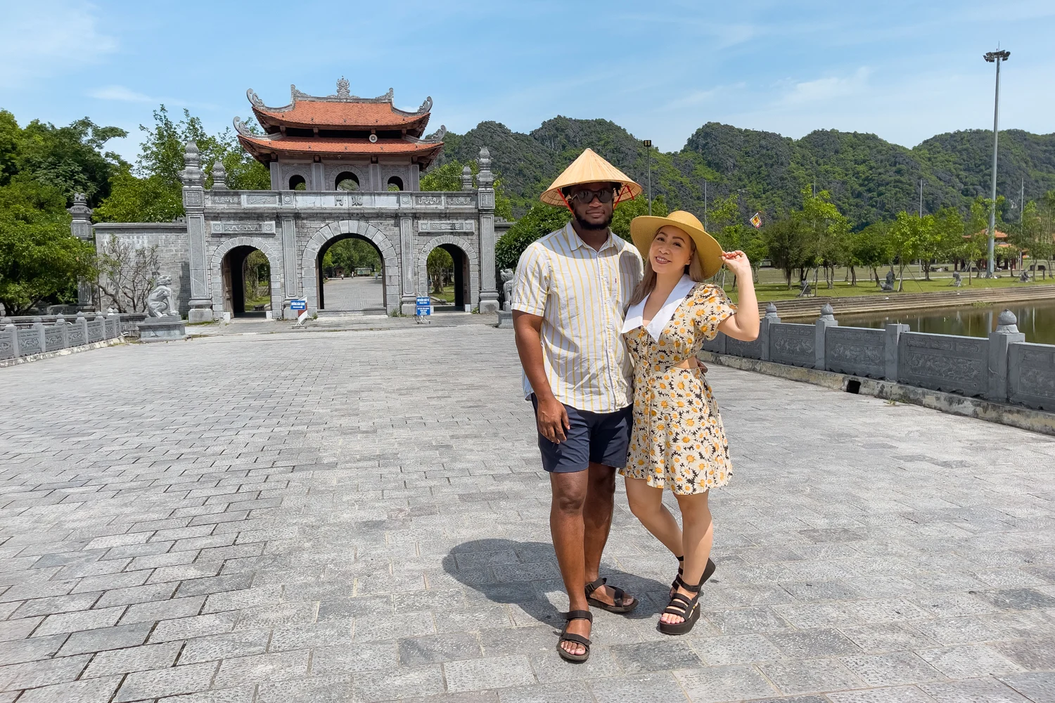 Couple at entrance of Hoa Lu Ancient Capital in Ninh Binh, Vietnam