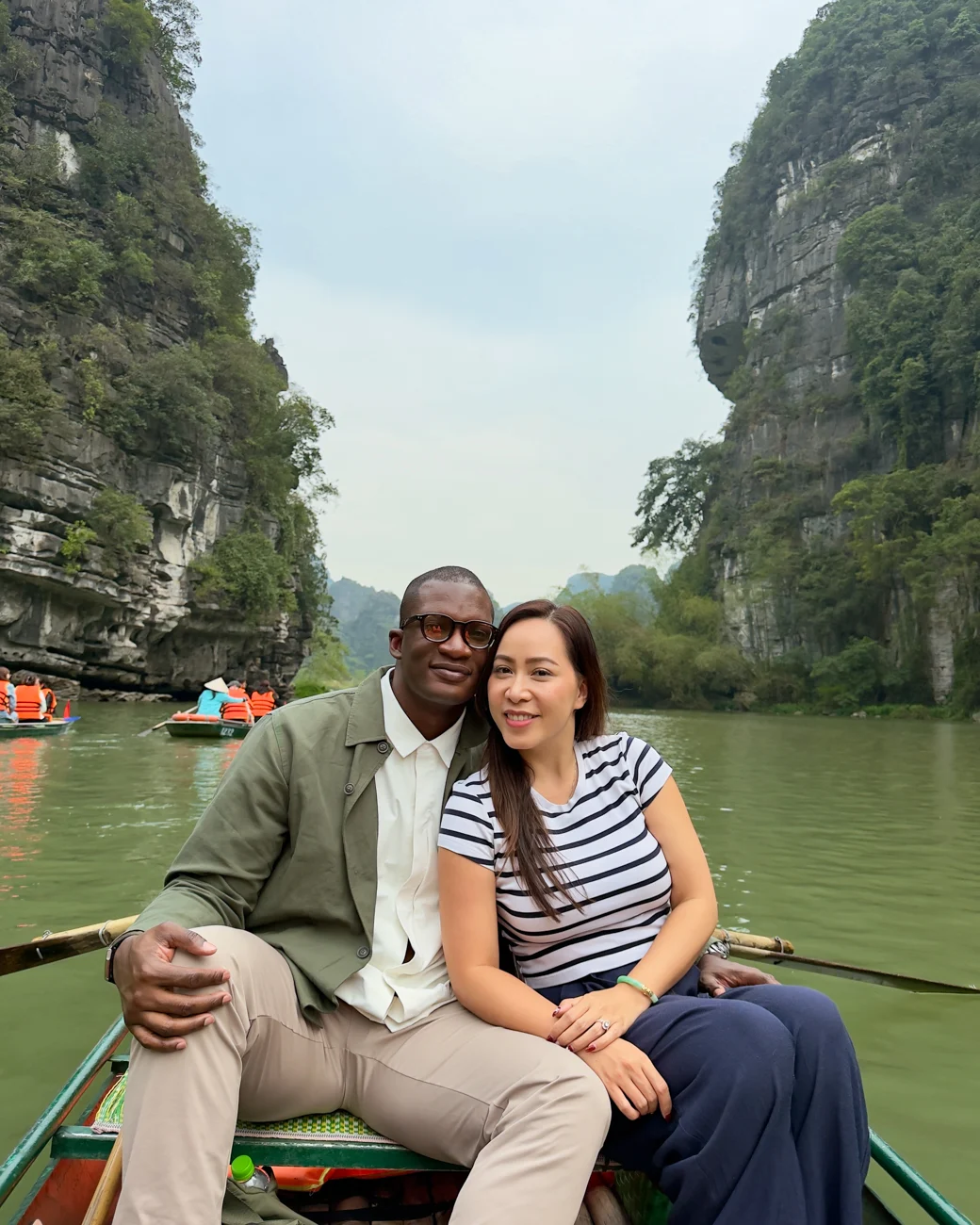 Couple on boat in Trang An in Ninh Binh, Vietnam.